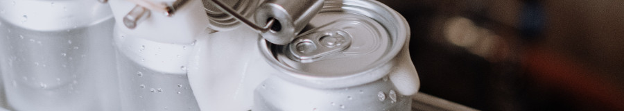 Cans Being Filled With Liquid by Cottonbro