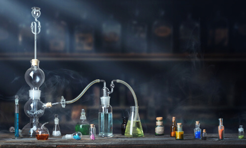 Various Glass Containers Containing Liquids and Connected by Tubing